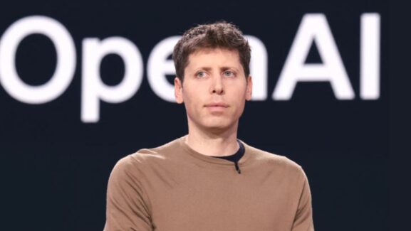 sam altman in front of the open ai logo